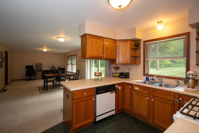 10926 Gorsline Rd, Battle Creek, MI 49014 - kitchen with dishwasher, a sink, a peninsula, brown cabinetry, and open shelves
