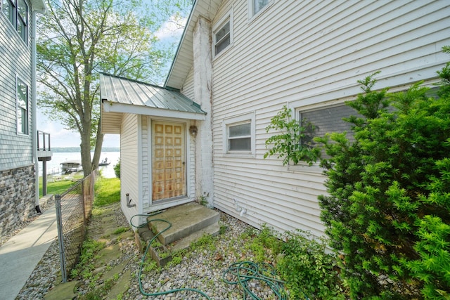 194 Pentecost Hwy, Onsted, MI 49265 - property entrance with a water view and metal roof