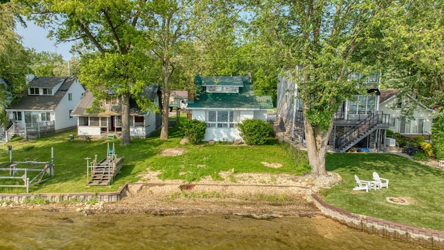 194 Pentecost Hwy, Onsted, MI 49265 - view of grassy yard featuring stairway and an outdoor fire pit