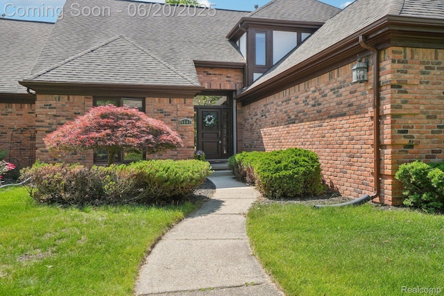 4541 Rivers Edge, Troy, MI 48098 - entrance to property featuring roof with shingles, brick siding, and a lawn