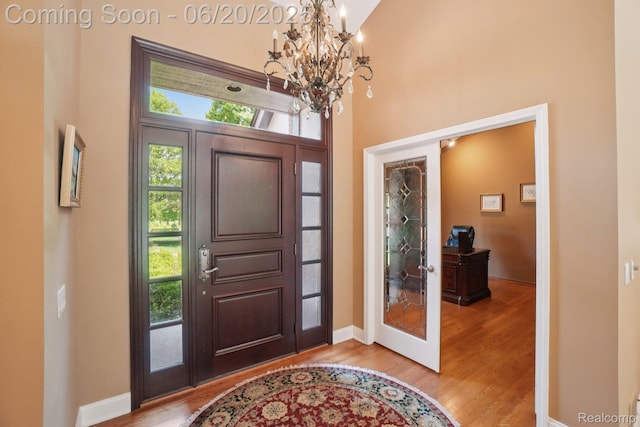 4541 Rivers Edge, Troy, MI 48098 - entryway featuring a chandelier, wood finished floors, and a high ceiling