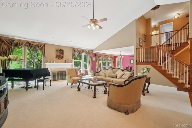 4541 Rivers Edge, Troy, MI 48098 - carpeted living room featuring a ceiling fan, stairs, a chandelier, high vaulted ceiling, and a glass covered fireplace