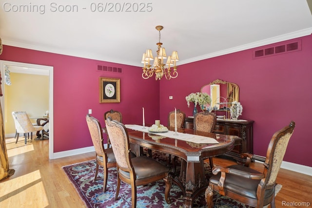 4541 Rivers Edge, Troy, MI 48098 - dining space with a chandelier, wood finished floors, and ornamental molding