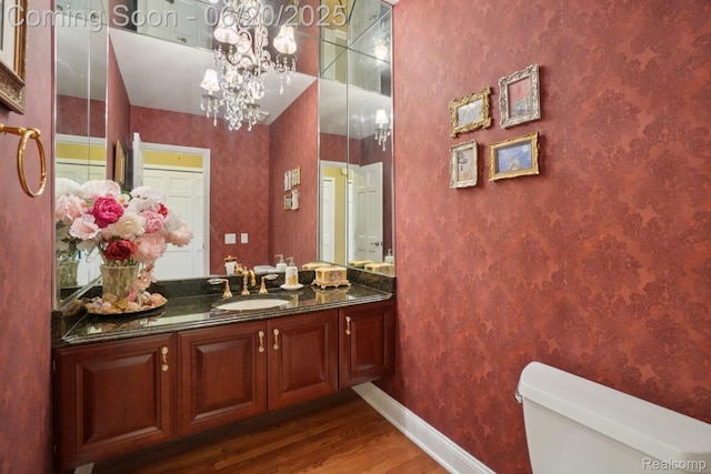 4541 Rivers Edge, Troy, MI 48098 - bathroom with wood finished floors, vanity, and a chandelier