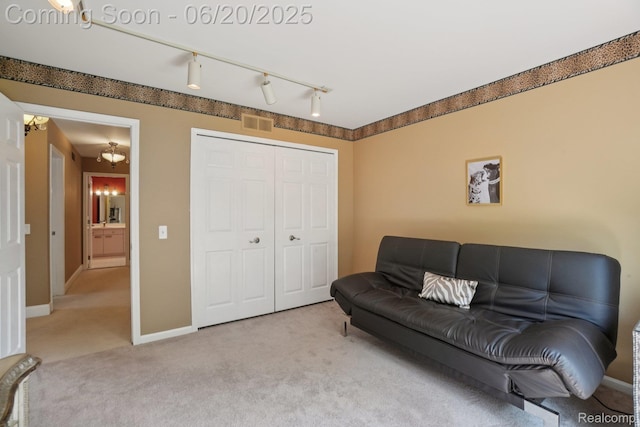 4541 Rivers Edge, Troy, MI 48098 - living area featuring carpet floors and rail lighting