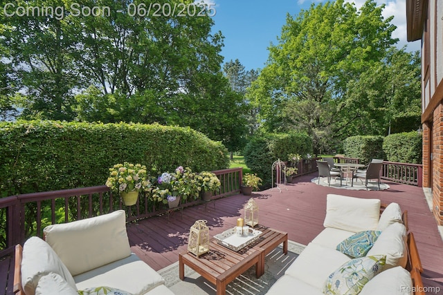 4541 Rivers Edge, Troy, MI 48098 - wooden deck featuring an outdoor living space, outdoor dining space, and view of wooded area
