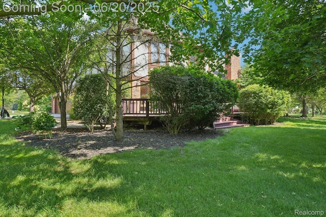 4541 Rivers Edge, Troy, MI 48098 - view of green lawn with a deck