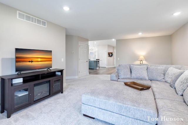 158 Brewer Park Cir, Grand Rapids, MI 49548 - living area featuring light carpet, baseboards, and recessed lighting