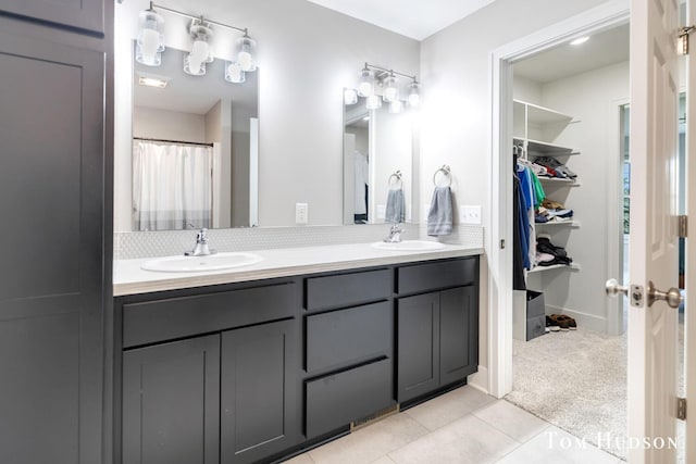 158 Brewer Park Cir, Grand Rapids, MI 49548 - bathroom with double vanity, tile patterned floors, and a closet