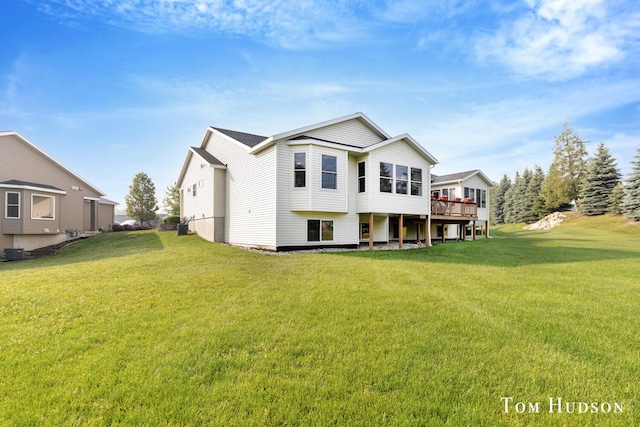158 Brewer Park Cir, Grand Rapids, MI 49548 - rear view of property featuring a lawn, a deck, and central AC