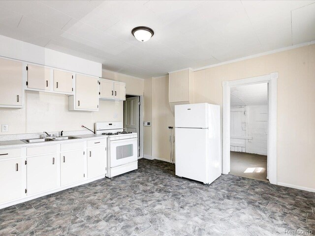 718 Superior St, Port Huron, MI 48060 - kitchen featuring white appliances, light countertops, crown molding, a sink, and white cabinets