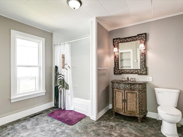 718 Superior St, Port Huron, MI 48060 - full bath with ornamental molding, vanity, toilet, shower / tub combo, and baseboards
