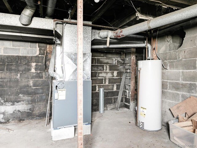 718 Superior St, Port Huron, MI 48060 - unfinished basement featuring water heater and heating unit