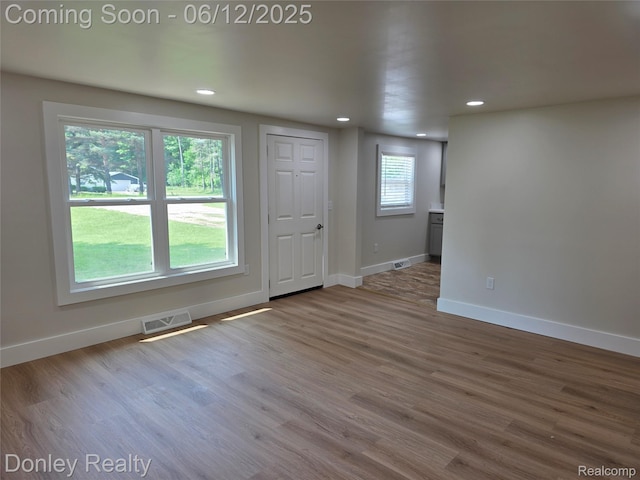 4514 Sebewaing Rd, Owendale, MI 48754 - spare room featuring baseboards, wood finished floors, and recessed lighting