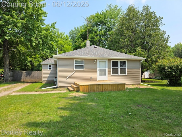 4514 Sebewaing Rd, Owendale, MI 48754 - rear view of property featuring a deck, a chimney, and roof with shingles