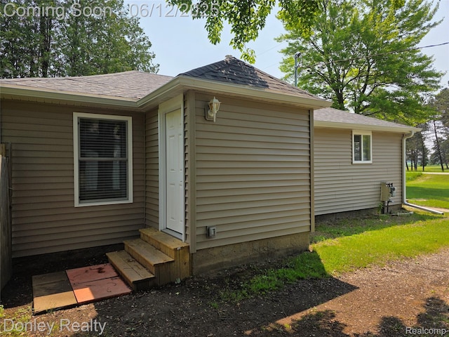 4514 Sebewaing Rd, Owendale, MI 48754 - view of side of home with entry steps and a shingled roof
