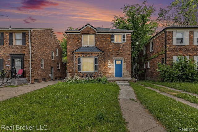 9236 Manistique St, Detroit, MI 48224 - view of front facade featuring a front yard and a shingled roof