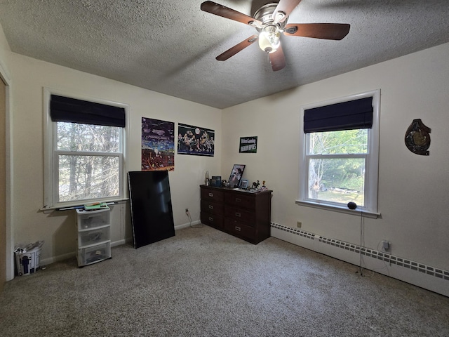 10017 M-115, Cadillac, MI 49601 - carpeted bedroom featuring a baseboard radiator, a textured ceiling, ceiling fan, and baseboards