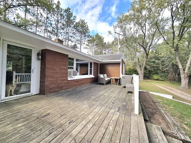 10017 M-115, Cadillac, MI 49601 - wooden deck featuring outdoor lounge area, cooling unit, and a lawn