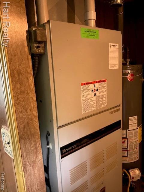 138 W Hunters Creek Rd, Lapeer, MI 48446 - utility room with water heater and heating unit