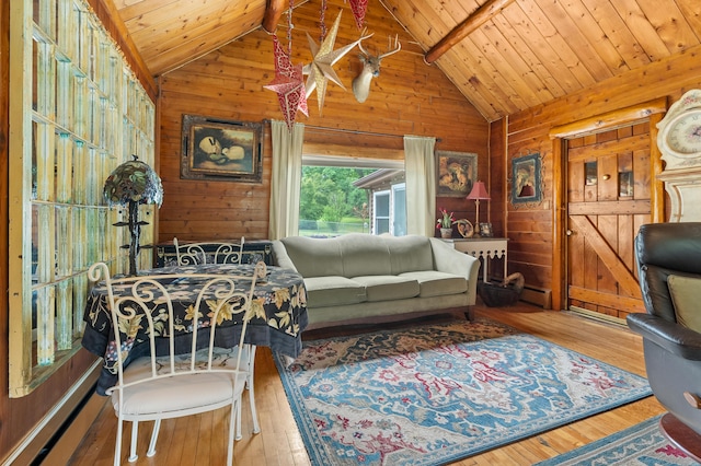 987 Wagner Dr, Battle Creek, MI 49017 - living room with wooden ceiling with exposed beams, wooden walls, hardwood / wood-style floors, and high vaulted ceiling