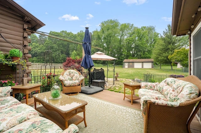 987 Wagner Dr, Battle Creek, MI 49017 - view of patio with an outdoor living space, an outdoor structure, and view of wooded area