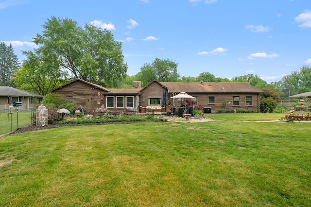 987 Wagner Dr, Battle Creek, MI 49017 - rear view of house featuring a chimney and central air condition unit