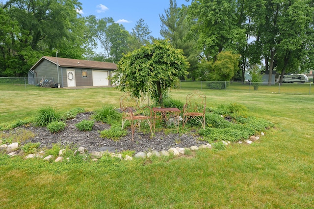 987 Wagner Dr, Battle Creek, MI 49017 - view of yard featuring an outbuilding and a garage