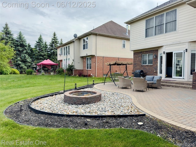 6038 Mayapple Dr, Troy, MI 48085 - rear view of property with brick siding, a lawn, a patio area, an outdoor living space with a fire pit, and entry steps
