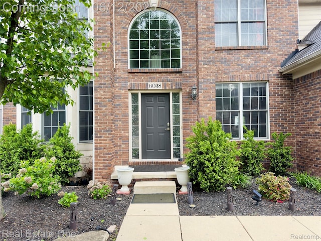 6038 Mayapple Dr, Troy, MI 48085 - doorway to property featuring brick siding