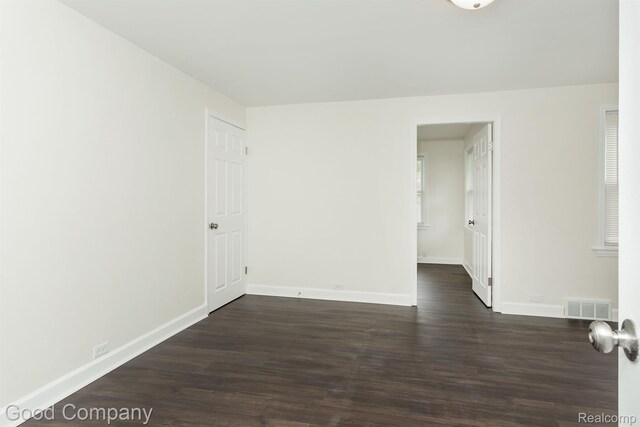 225 Euclid St, Mount Clemens, MI 48043 - spare room with dark wood-style flooring and baseboards