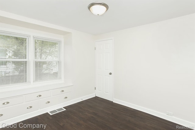 225 Euclid St, Mount Clemens, MI 48043 - empty room featuring dark wood-type flooring and baseboards