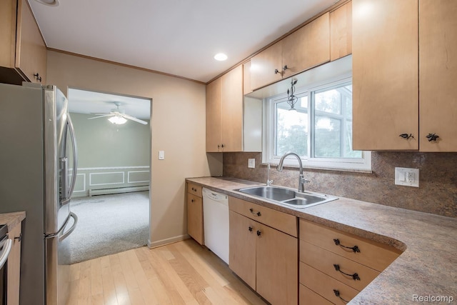 1231 Duckwood Ct, White Lake, MI 48383 - kitchen with appliances with stainless steel finishes, baseboard heating, light wood-type flooring, light brown cabinets, and a ceiling fan