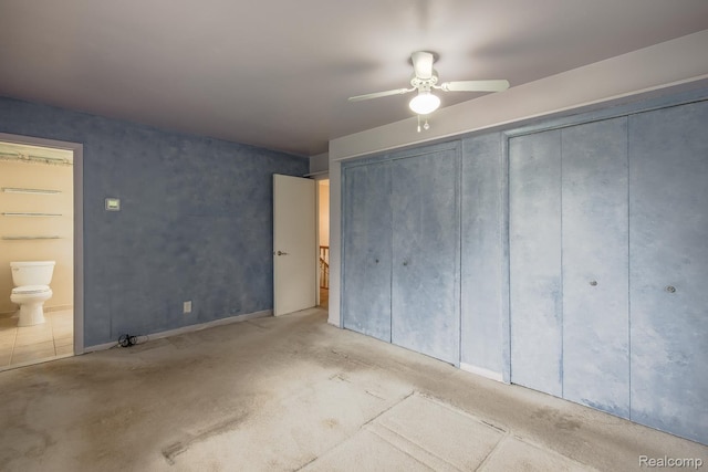 1231 Duckwood Ct, White Lake, MI 48383 - unfurnished bedroom featuring ensuite bathroom, carpet flooring, and a ceiling fan