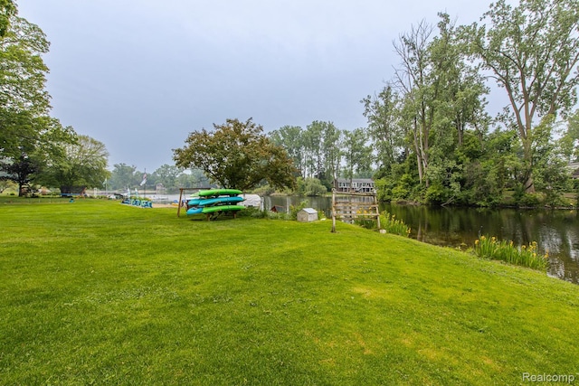 1231 Duckwood Ct, White Lake, MI 48383 - view of green lawn featuring a water view