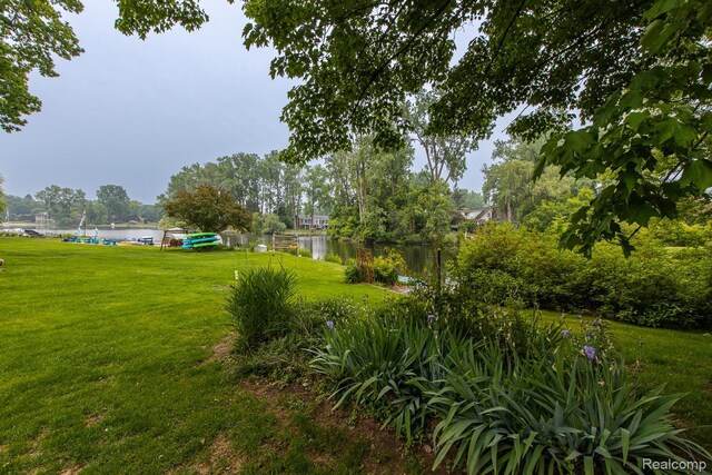 1231 Duckwood Ct, White Lake, MI 48383 - view of grassy yard with a water view