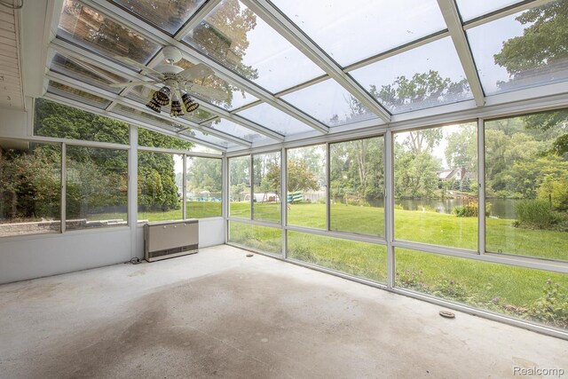 1231 Duckwood Ct, White Lake, MI 48383 - unfurnished sunroom with a water view, ceiling fan, and view of wooded area