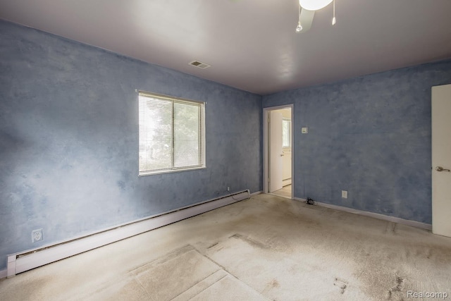 1231 Duckwood Ct, White Lake, MI 48383 - unfurnished room featuring a baseboard heating unit, healthy amount of natural light, and carpet floors