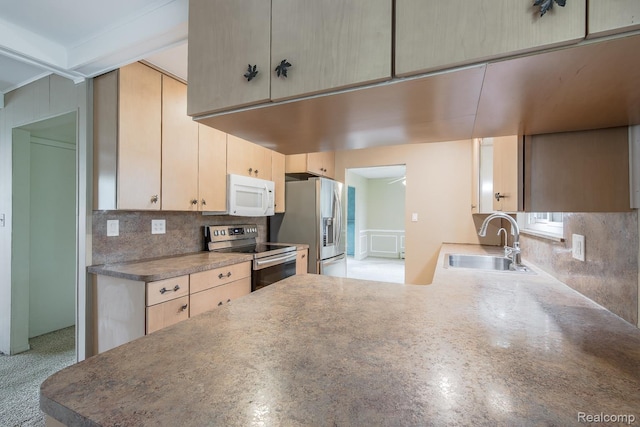 1231 Duckwood Ct, White Lake, MI 48383 - kitchen featuring appliances with stainless steel finishes, backsplash, a peninsula, and light brown cabinets