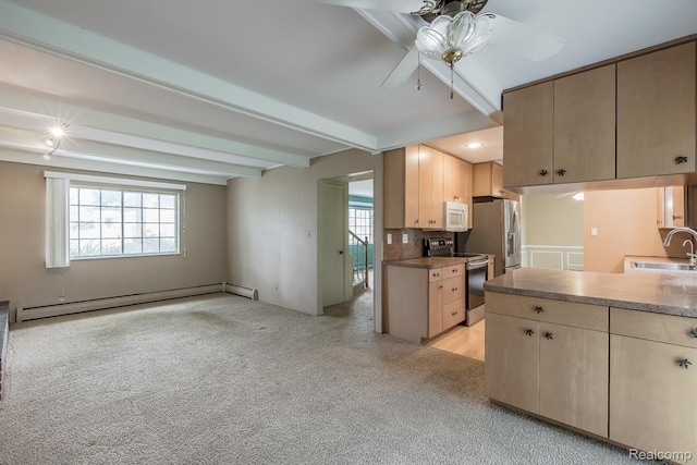 1231 Duckwood Ct, White Lake, MI 48383 - kitchen with appliances with stainless steel finishes, baseboard heating, ceiling fan, healthy amount of natural light, and beamed ceiling
