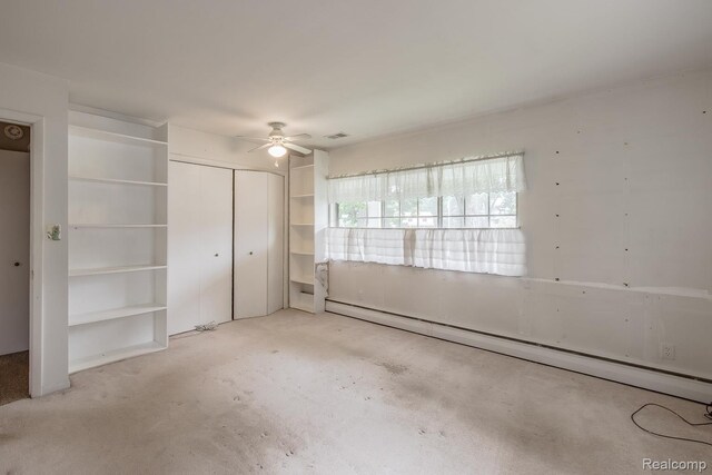 1231 Duckwood Ct, White Lake, MI 48383 - unfurnished bedroom with a baseboard radiator, a closet, and ceiling fan
