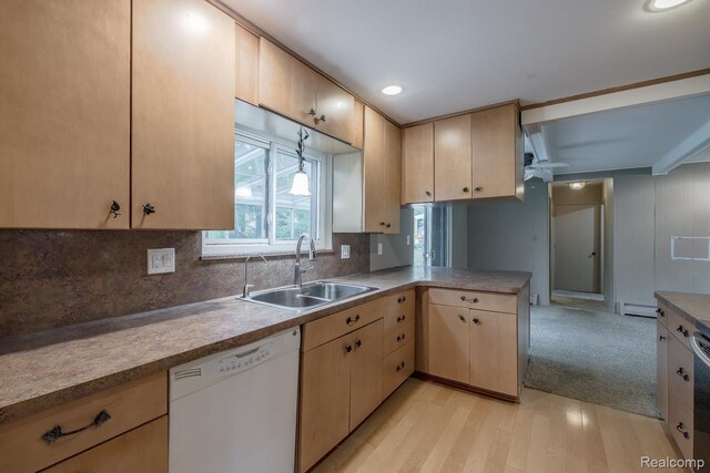 1231 Duckwood Ct, White Lake, MI 48383 - kitchen with white dishwasher, a peninsula, ceiling fan, tasteful backsplash, and a baseboard heating unit