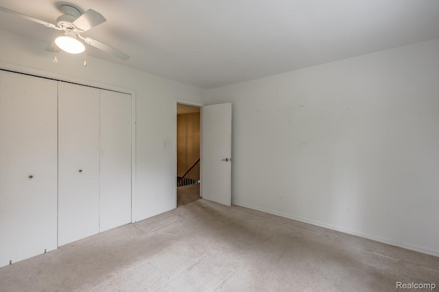 1231 Duckwood Ct, White Lake, MI 48383 - unfurnished bedroom featuring light colored carpet, a closet, and a ceiling fan