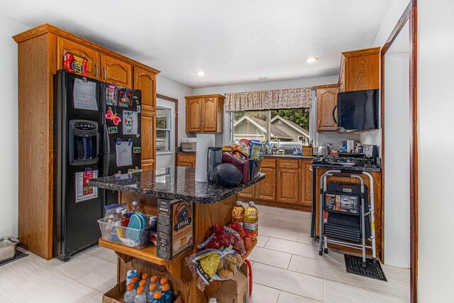 512 Clark St, Big Rapids, MI 49307 - kitchen with black appliances, open shelves, brown cabinets, a center island, and recessed lighting
