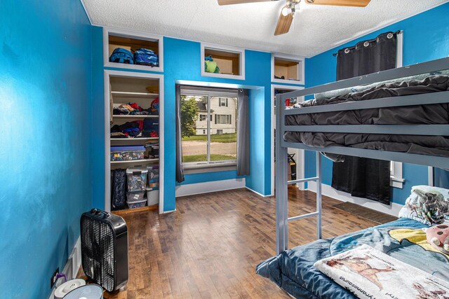 512 Clark St, Big Rapids, MI 49307 - bedroom with a textured ceiling, wood finished floors, and ceiling fan