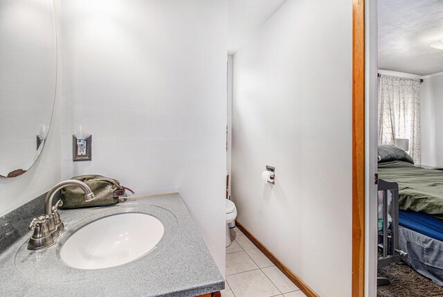 512 Clark St, Big Rapids, MI 49307 - bathroom with ensuite bath, toilet, vanity, and tile patterned floors