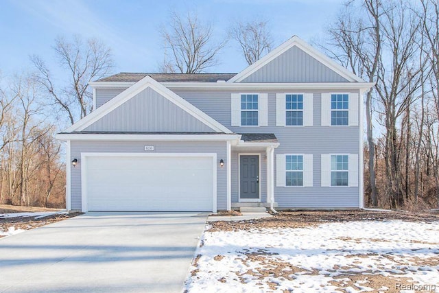 2099 Stillwater Dr, Davison, MI 48423 - view of front of house with concrete driveway, a garage, and board and batten siding