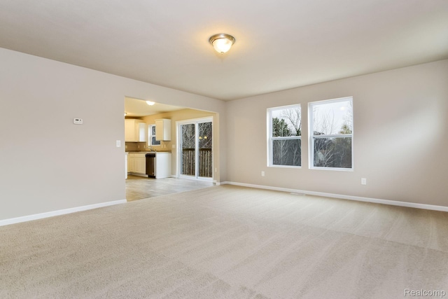 2099 Stillwater Dr, Davison, MI 48423 - spare room featuring light carpet and baseboards