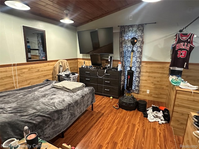 5150 Lafave Rd, Black River, MI 48721 - bedroom featuring wainscoting, wooden walls, wood finished floors, wooden ceiling, and vaulted ceiling