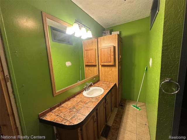 5150 Lafave Rd, Black River, MI 48721 - bathroom with vanity, a textured ceiling, and tile patterned floors